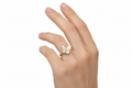 A gold-plated open ring with a pearl and a butterfly design with white and blue enamel wings.