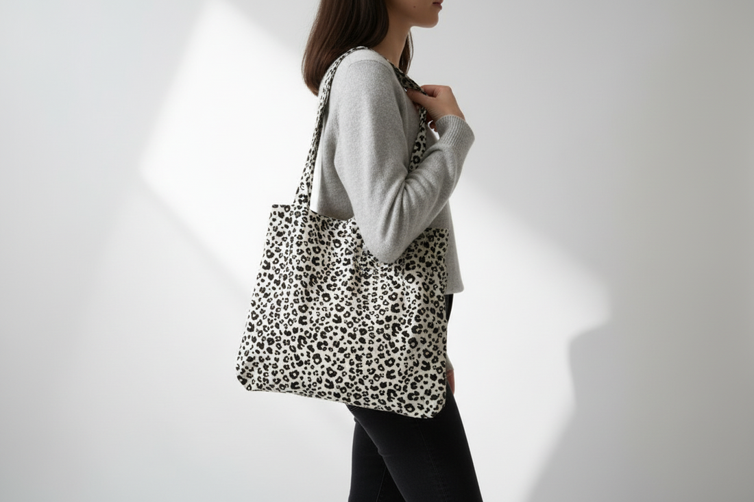 Leopard print handbag on a light gray background