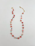 Multicolored beaded necklace on a white background