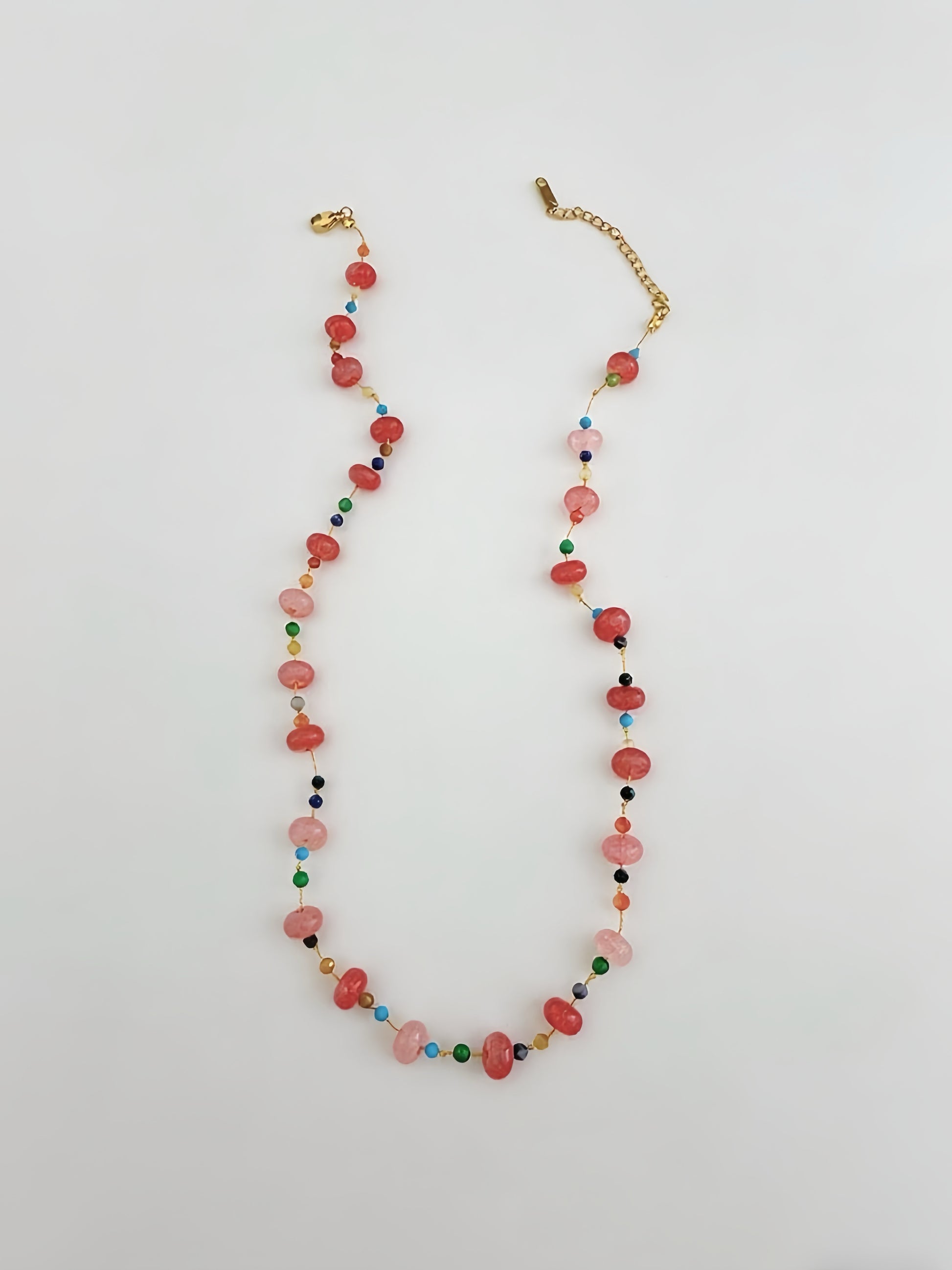 Multicolored beaded necklace on a white background