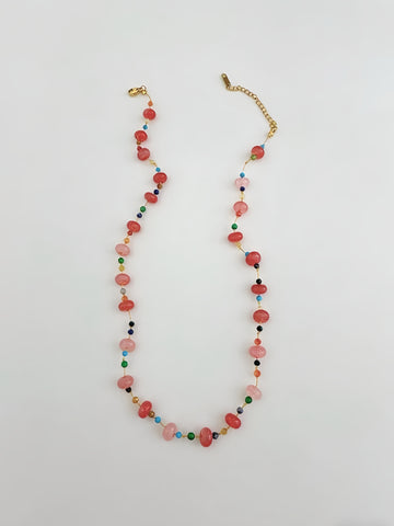 Multicolored beaded necklace on a white background
