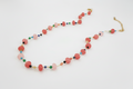 Multicolored beaded necklace on a white background